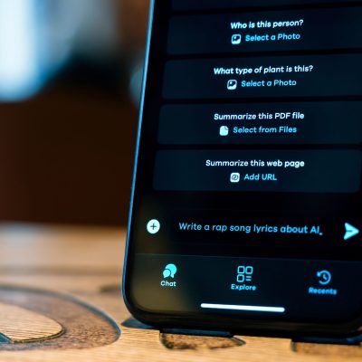Phone with opened AI chat. Write a rap song about AI request in the dialogue