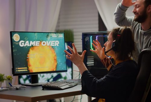 stressed-couple-gamers-losing-space-shooter-video-game-playing-rgb-powerful-computer-while-streaming-online-competition-pro-cyber-woman-with-headset-performing-from-home-virtual-tournament (1)